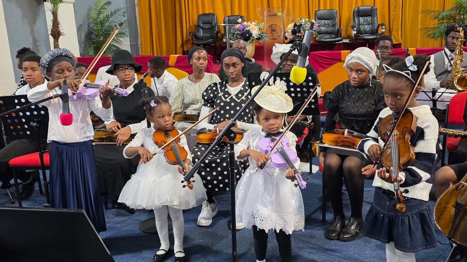 Young Davito Musicals string students with violins and cello