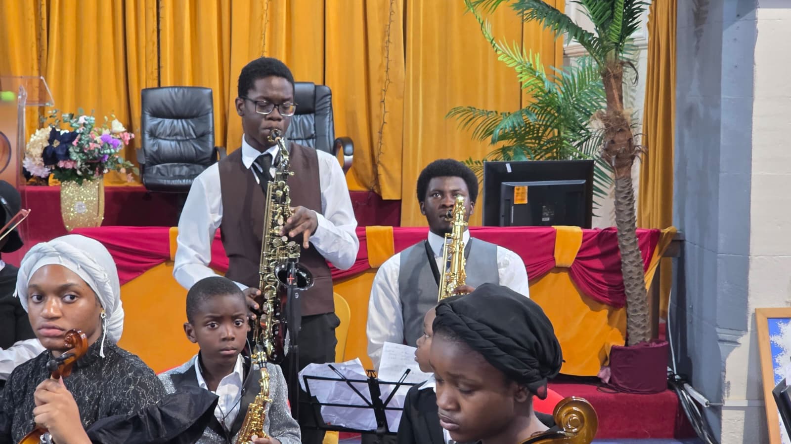 Davito Musicals students playing saxophone in an ensemble